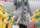 Tripulação encapotada, avião desinfetado: como são voos de resgate na China... 